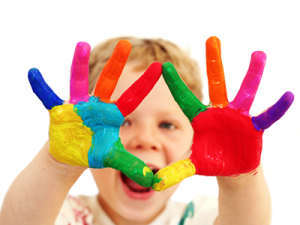 Kid with colored paint on hands