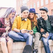 Group of teens looking at a phone