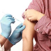 Person receiving a vaccine in their arm