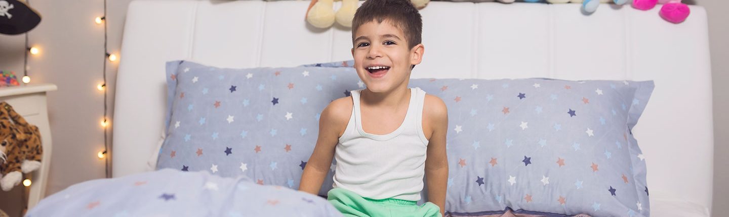 happy boy in bed