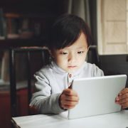 little boy looking at tablet