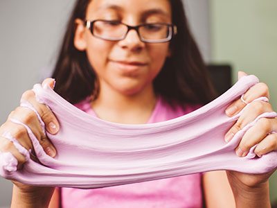 girl playing with slime