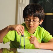 little boy doing math homework-feature