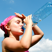girl drinking water to stay cool on a hot day