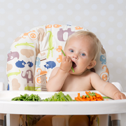 Baby girl eating raw food