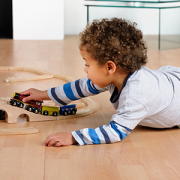 Toddler Playing With Train Set