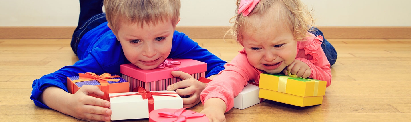 Brother and sister fighting over presents