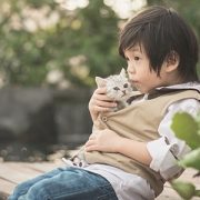 Boy holding kitten