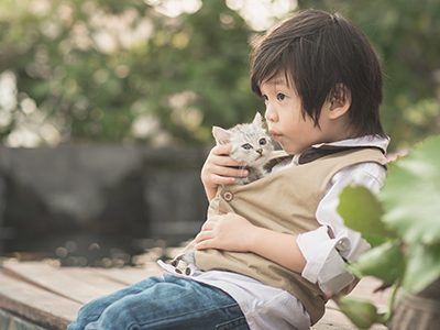 Boy holding kitten
