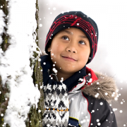 boy standing in the snow