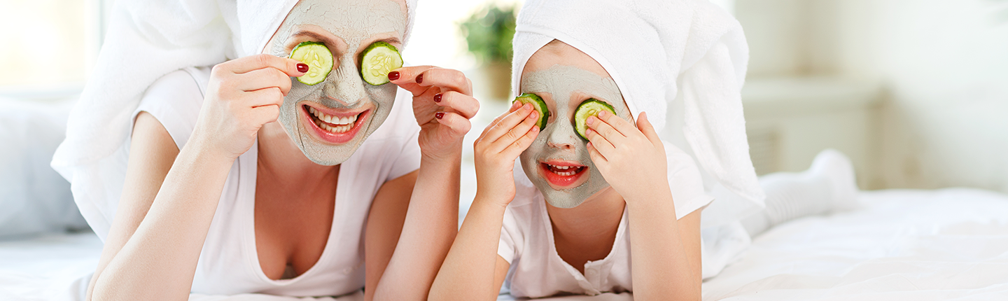 mother and daughter doing face masks