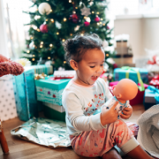 Little Girl Opening Gifts
