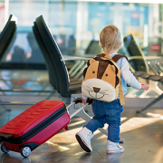 child pulling suitcase