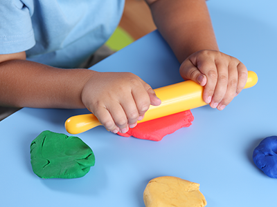 Child playing with Play-Doh