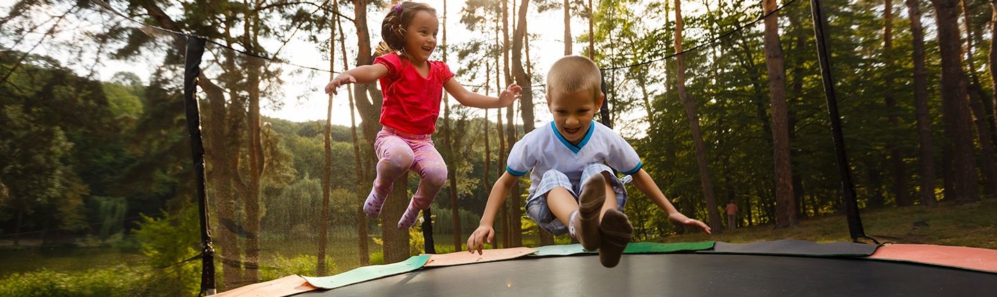 kids jumping on trampoline