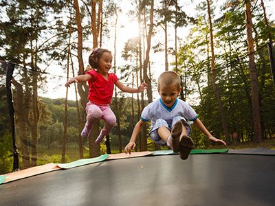 Cartoon Kids Jumping On Trampoline