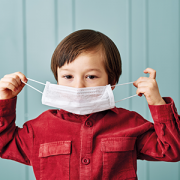 child wearing surgical mask