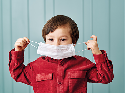 child wearing surgical mask