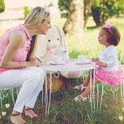 mom and daughter having a tea party