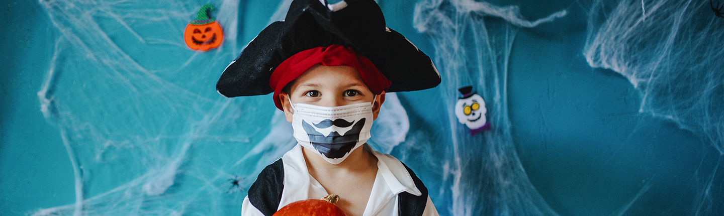 boy in mask dresses as pirate