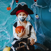 boy in mask dresses as pirate