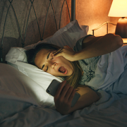 teen girl in bed yawning