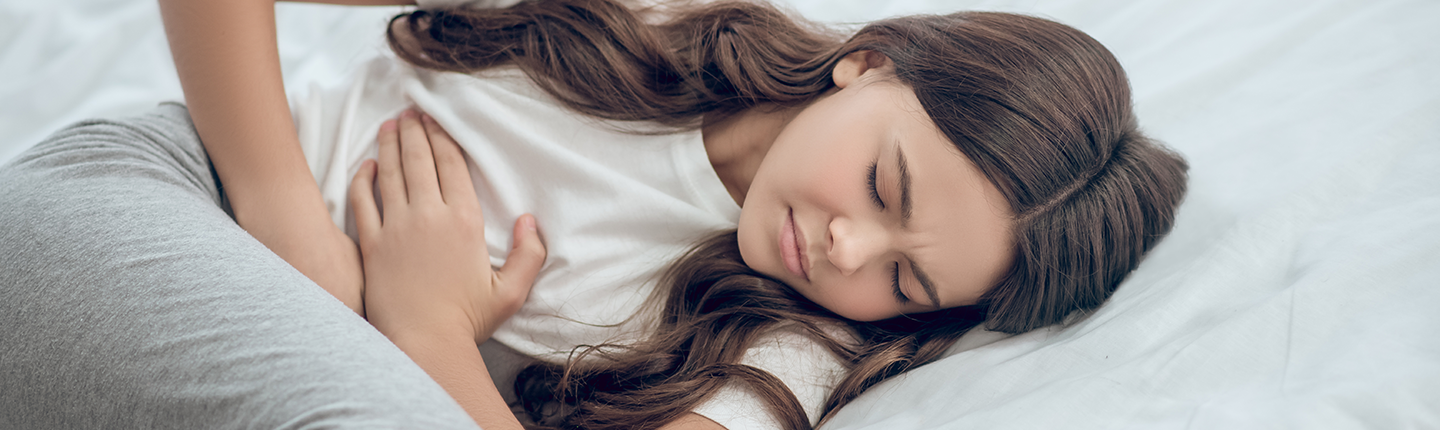 teen girl with stomach ache