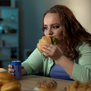 teen eating a burger