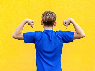 Boy flexing his muscles