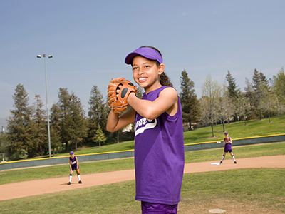 girl pitching softball