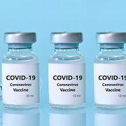 COVID-19 vaccine vials and needle