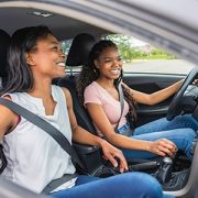 mother and daughter driving