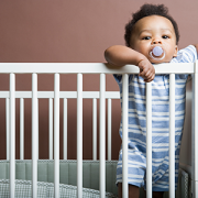baby in crib with pacifier