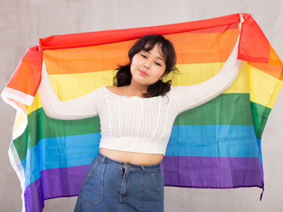 girl holding pride flag
