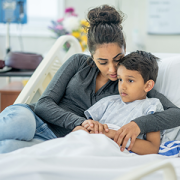 mother comforting son in hospital