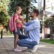 Father sending daughter off to school