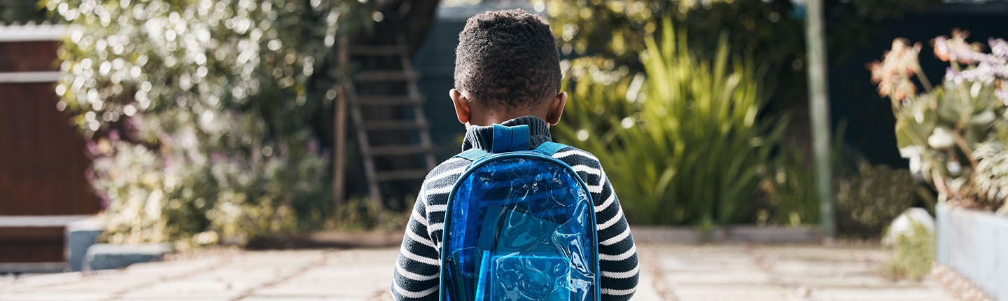 sad boy with backpack