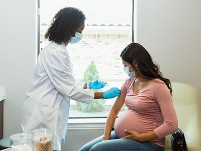 pregnant woman getting vaccine