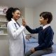 School nurse giving a student a high five