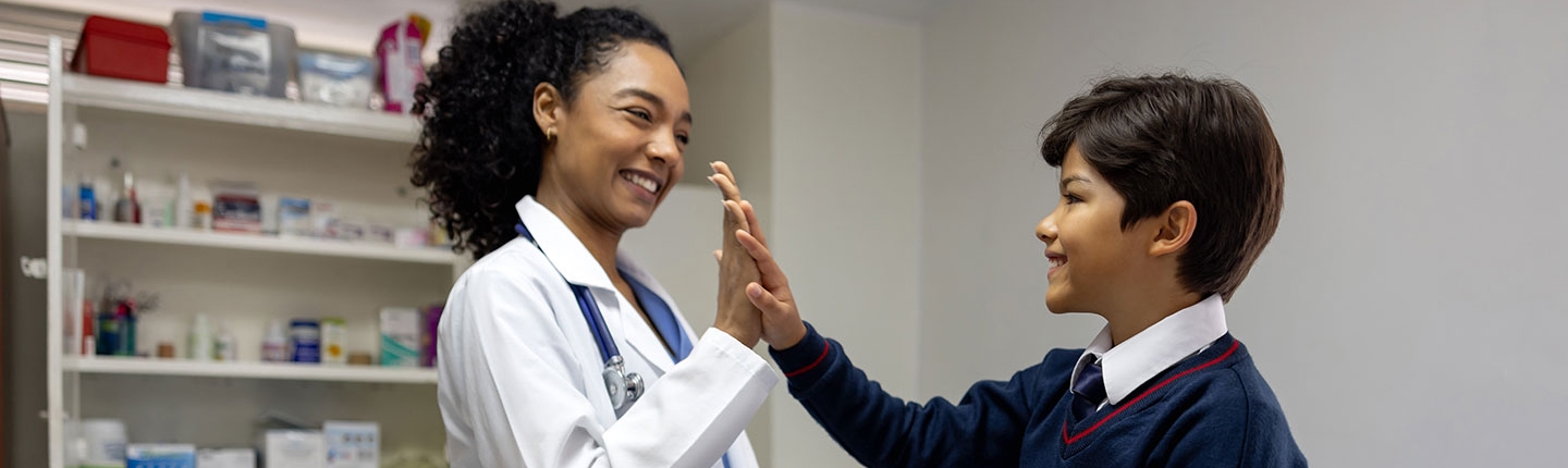 School nurse giving a student a high five