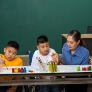 Autism children learning drawing art in classroom with teacher