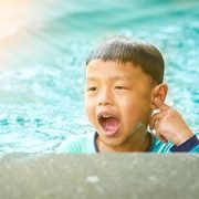 Child touching their ear