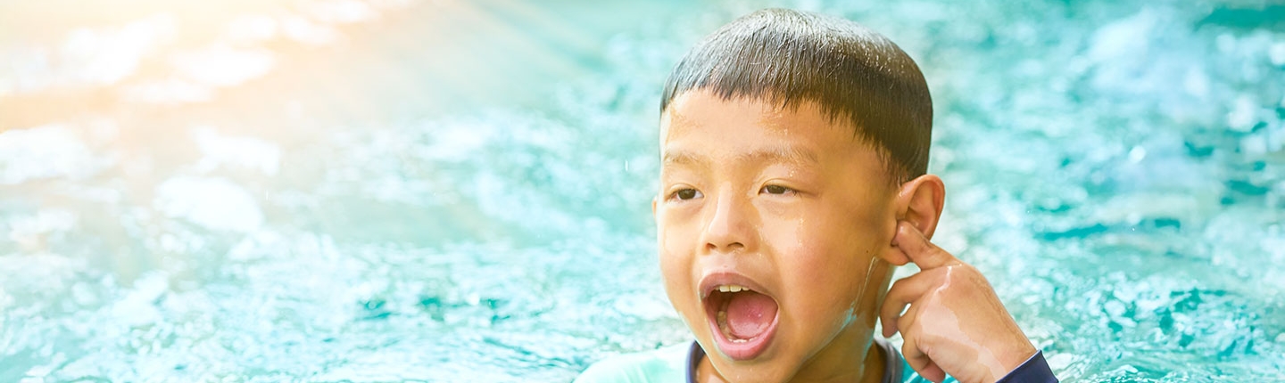Child touching their ear