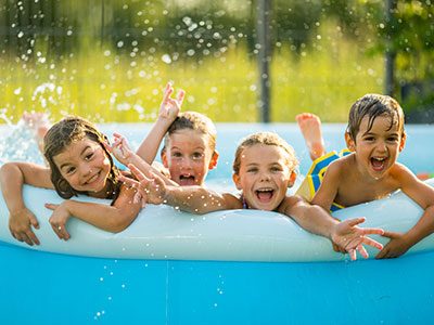 Happy kids in a swimming pool
