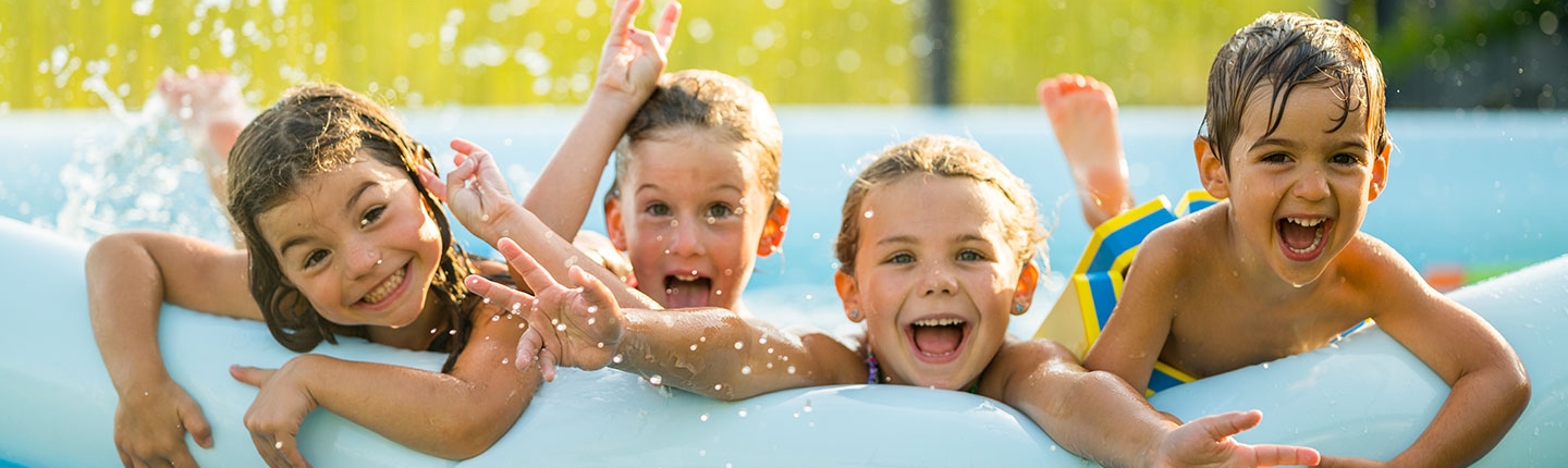 Happy kids in a swimming pool