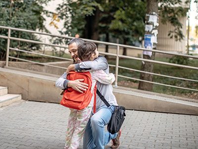 Child and parent hugging