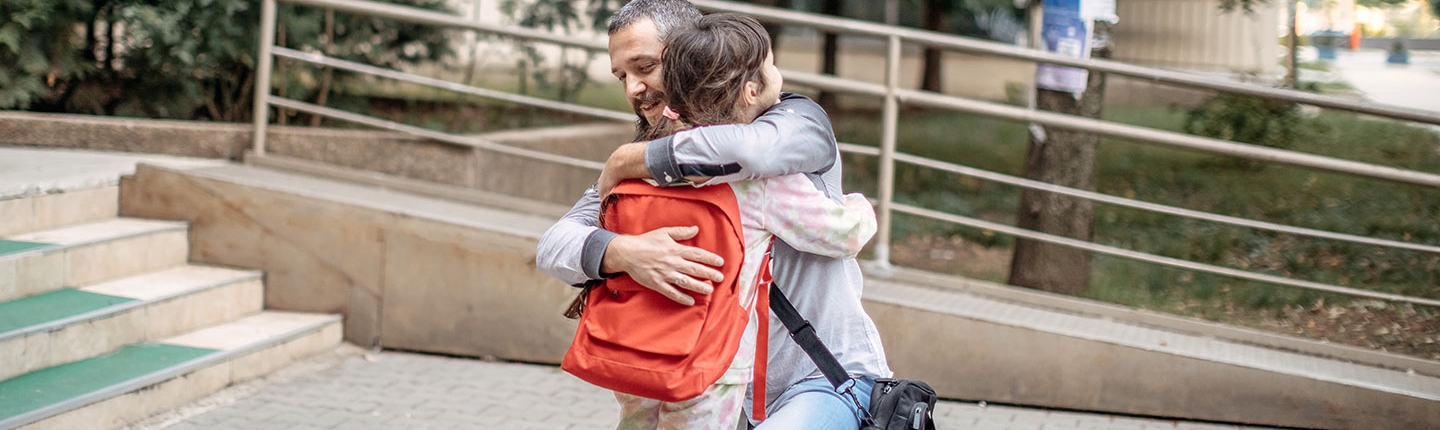 Child and parent hugging