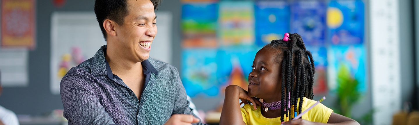 Teacher helping a student with school work