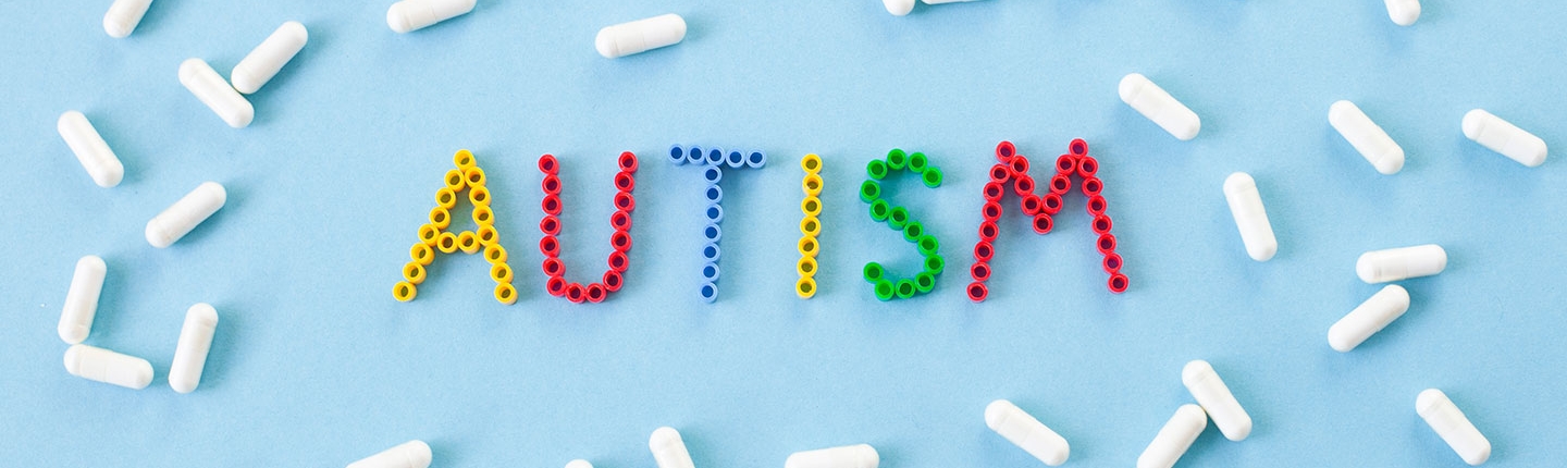 the word autism surrounded by pills