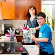 autistic boy doing dishes